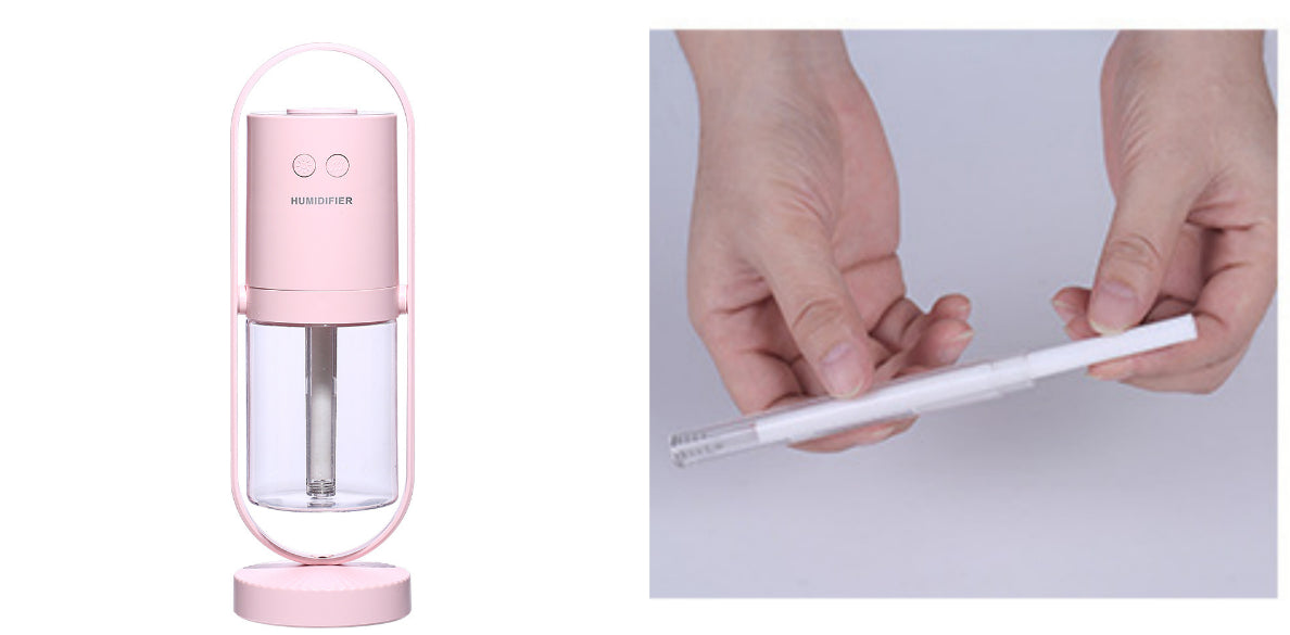 Aurora projection humidifier in pink, shown with the spare wick